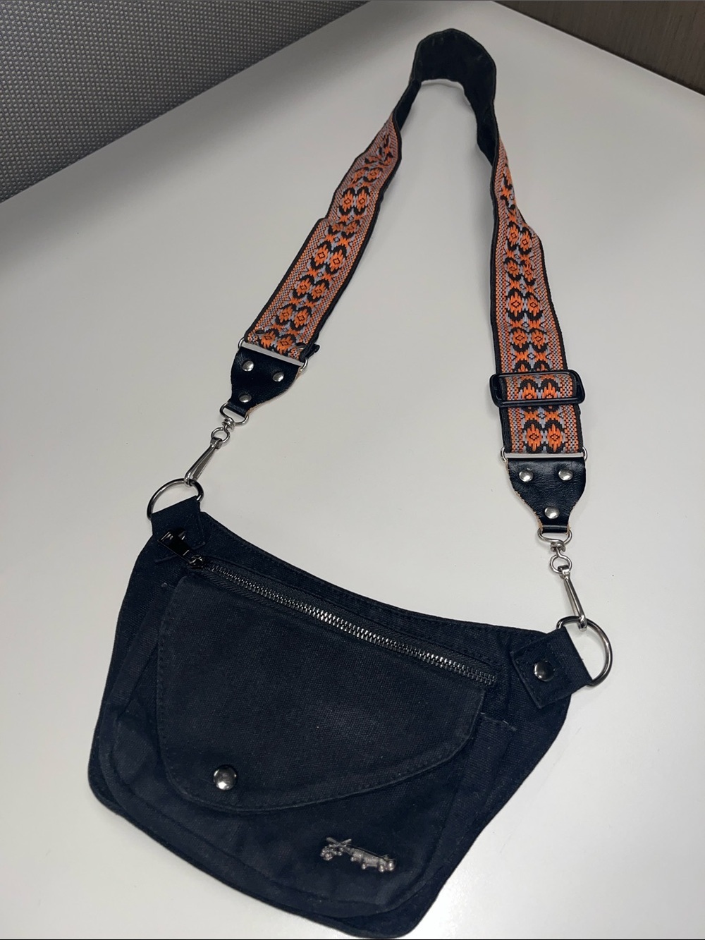 Cinnamon Lux Hip Black Pouch Crossbody Bag with Patterned Strap
